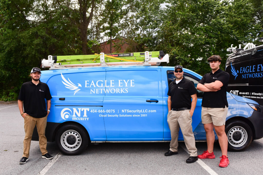 NT Security professional team of installers posing near their work van in Lilburn, GA.