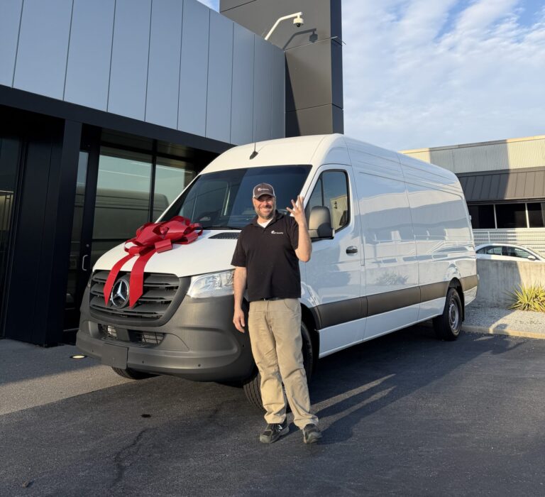Nick Tinsley celebrating 25 years in security with a new van.