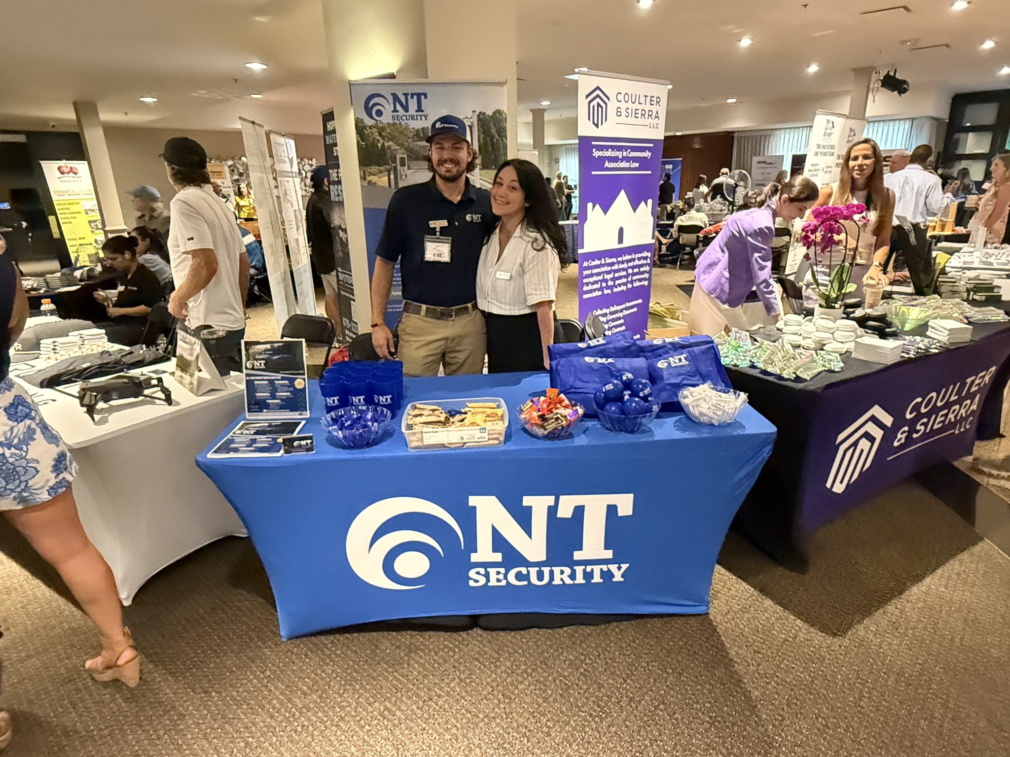 Photo of Vinny and Rachael, our NT Security team at September 2026 AMG Tradeshow