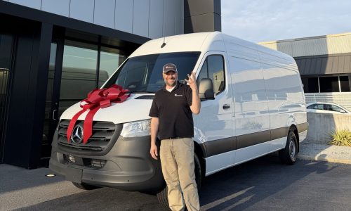 Nick Tinsley celebrating 25 years in security with a new van.