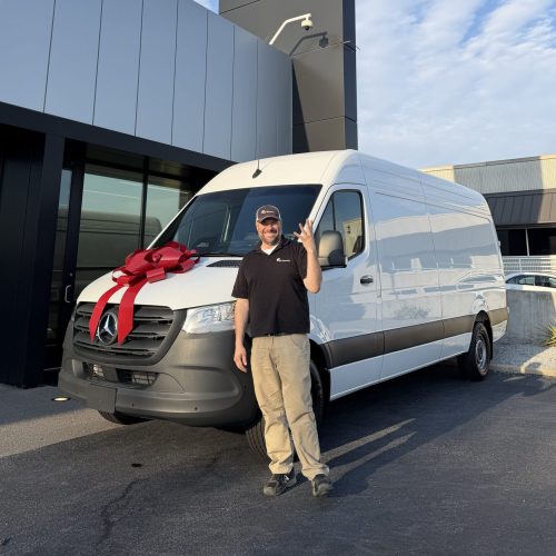 Nick Tinsley celebrating 25 years in security with a new van.